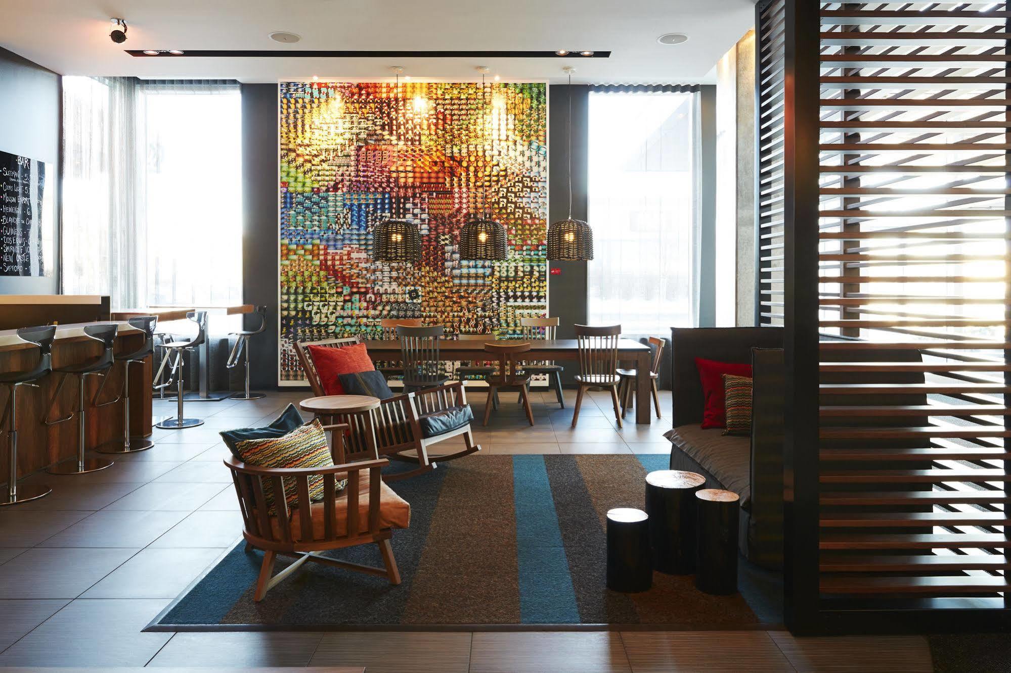 Hotel Alt Quartier Dix30 Броссар Экстерьер фото